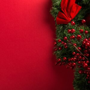 Christmas wreath at red background