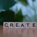 Träbokstäver som stavar "CREATE".